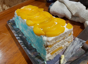 Una foto de Torta de tres leches con duraznos (de galletas)