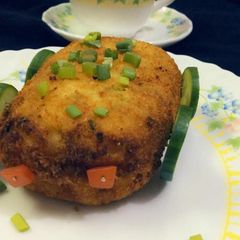 A picture of Chicken stuff potato sandwich.