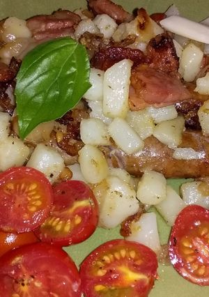 A picture of Pork Sausage with Potato, Cherry Tomatoes, and Cheese Sandwich.