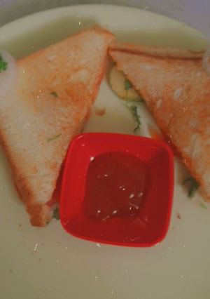 A picture of 3 layered cheese sandwich.