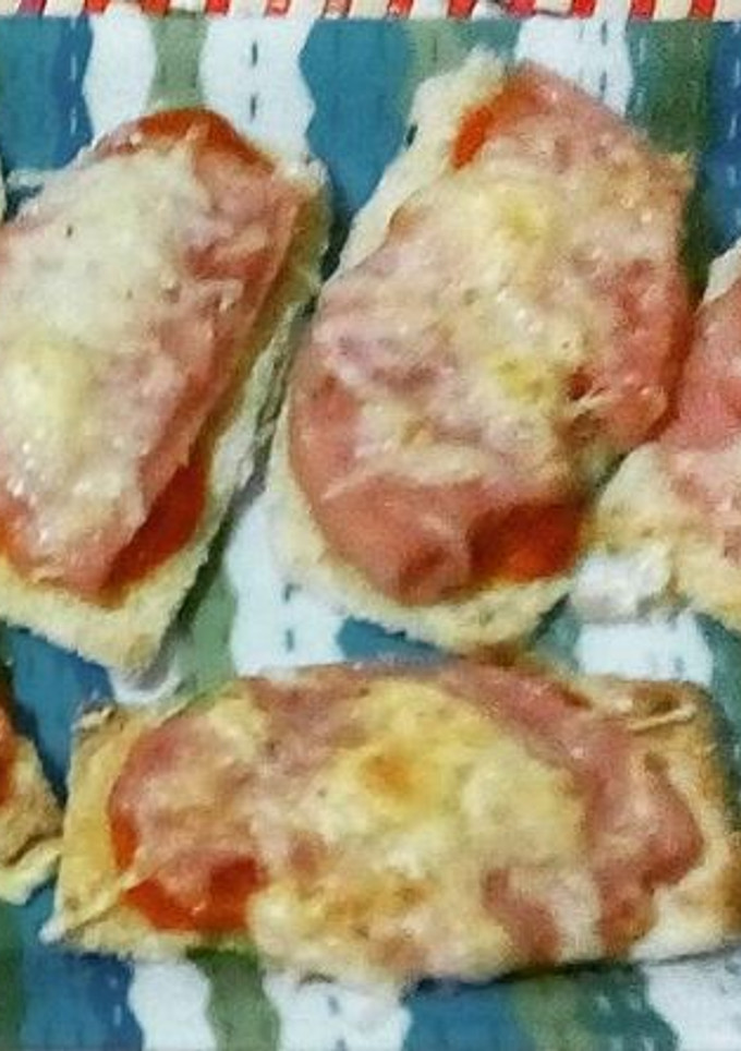 Una foto de Láminas de berenjenas con jamón y queso