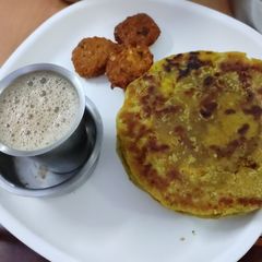 A picture of Bogi festival puran poli(sweet) Dal vada, coffee.