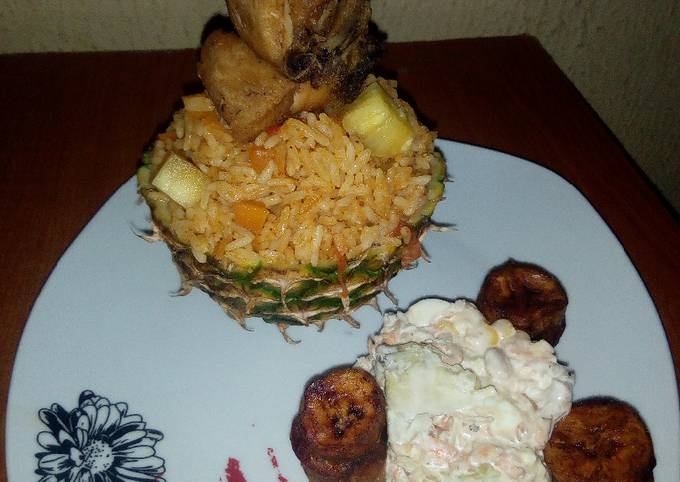 Pineapple Jollof Rice, with Coleslaw, fried Chicken and Plantain