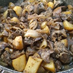 Liver with onion and potatoes cooked with spices and red wine A picture of Liver with onion and potatoes cooked with spices and red wine.