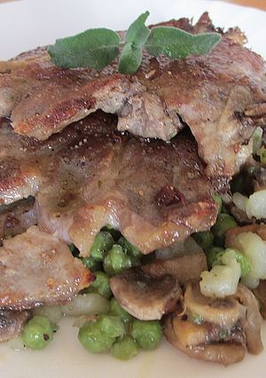 Una foto de Carne de cerdo con guisantes