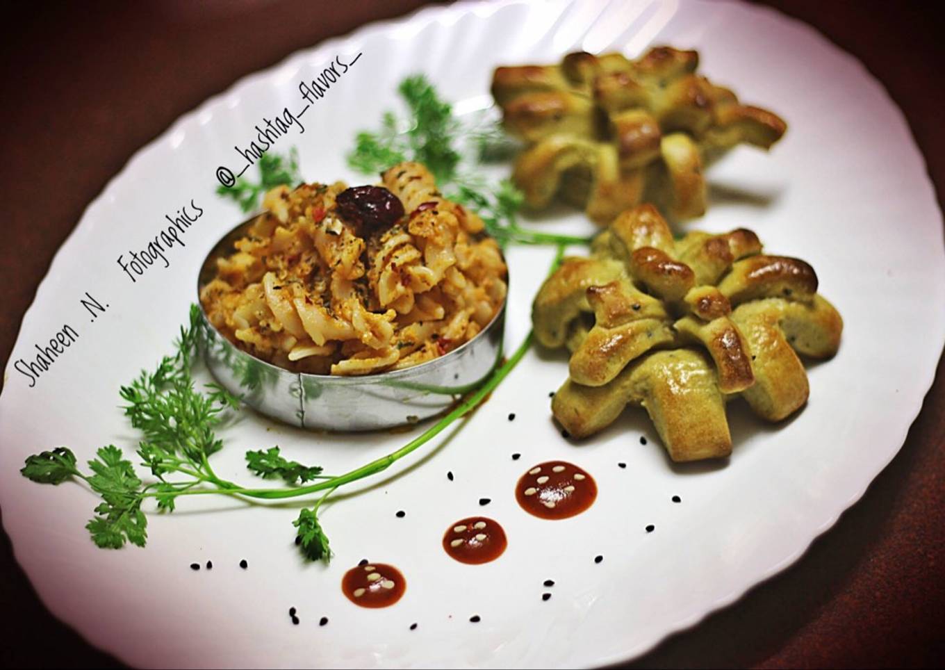 Fusilli pasta in red sauce with herbed pesto bread