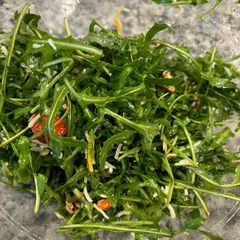A picture of Steve’s Arugula Salad with Light Zesty Dressing.