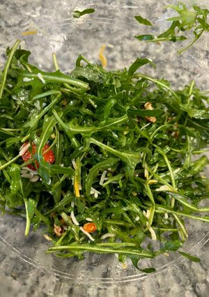 A picture of Steve’s Arugula Salad with Light Zesty Dressing.