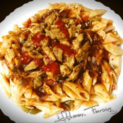 A picture of Chicken Pasta with Spicy Red Sauce.