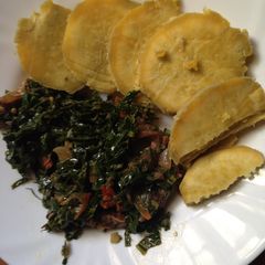 A picture of Mixed beef and kale served with sweet potatoes.