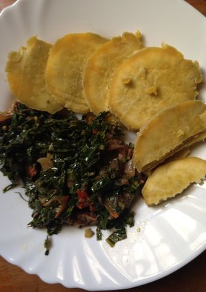 A picture of Mixed beef and kale served with sweet potatoes.