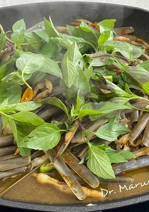 A picture of Stir Fried Razor Clams (Navajas) with Fresh Chili and Sweet Basil.