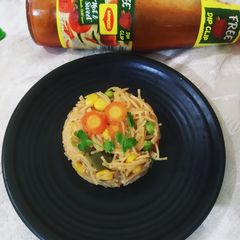 A picture of Vermicelli pulao with lots of veggies.