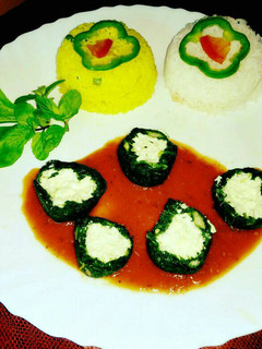 A picture of Palak paneer kofta in tomato gravy.