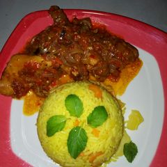 A picture of Yellow rice with sauce.