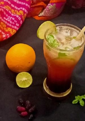 A picture of Mulberry Orange Sunset layered Mocktail.