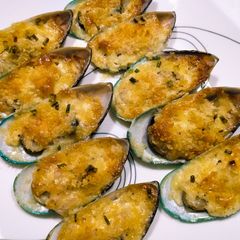 A picture of Baked mussels in the half-shell.