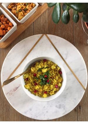 A picture of Aloo Poha - Turmeric flavoured Flattened Rice with Potato.