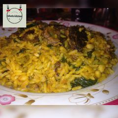 Palm oil rice and beans jallof with spinach A picture of Palm oil rice and beans jallof with spinach.