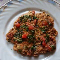 Egg tomato onion omlette A picture of Egg tomato onion omlette.