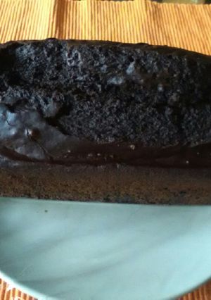 Una foto de Bizcocho vegano. Algarroba y flor de azahar