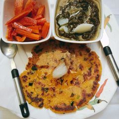 A picture of Sarson ka sag with Makke di roti.