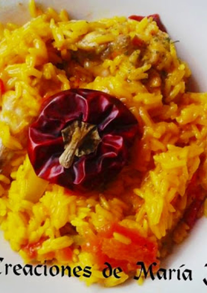 Una foto de Arroz con pollo y ñora