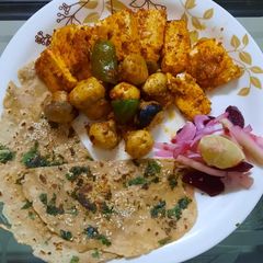 A picture of Paneer mushrooms tawa fry with wheat naan.