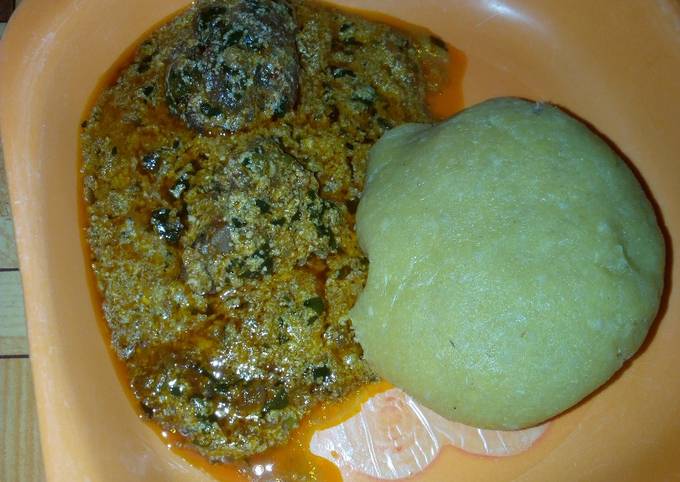 Eba and egussi soup with meat