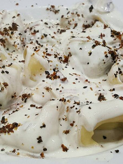 Una foto de Tortelinis de ricota y espinacas con salsa Alfredo