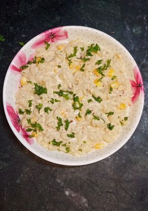 A picture of Corn cheese pasta in peri peri white sauce.