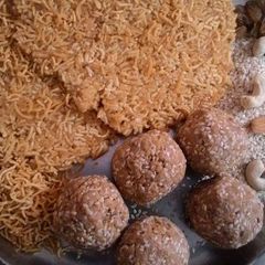 A picture of Salty Namkeen patti with Til Ladoo.