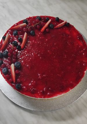 A picture of Gluten-Free and Dairy-Free Cheesecake with Strawberry Coulis.