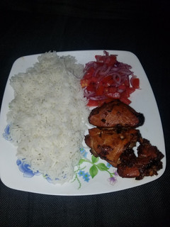 A picture of Chicken glazed with lemon soy sauce and garlic.