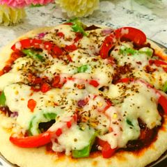 A picture of Pan Pizza with paneer stuffing without yeast.