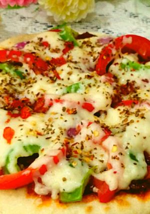 A picture of Pan Pizza with paneer stuffing without yeast.