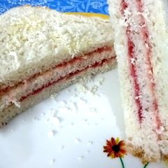 A picture of Cheese layered butter jam sandwich.