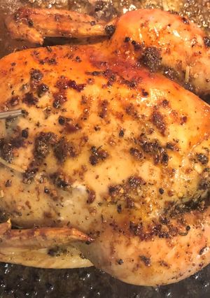 A picture of Oven baked whole chicken.