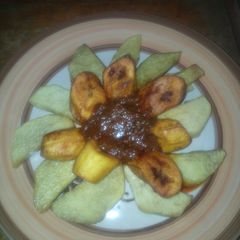 A picture of Fried yam,plantain with stew.