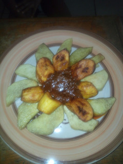 A picture of Fried yam,plantain with stew.