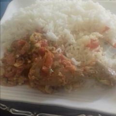 A picture of Rice with chicken stew.