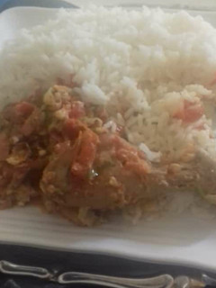 A picture of Rice with chicken stew.