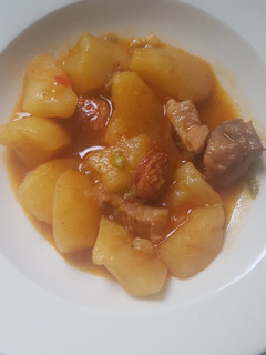 Una foto de Patatas con magro