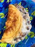 Omelette con champiñones y queso