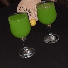 A picture of 🥒+🍊+🍋+mint leave drink.