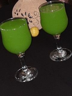 A picture of 🥒+🍊+🍋+mint leave drink.