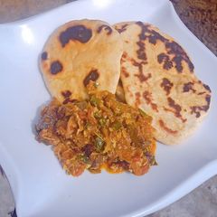 A picture of Pita bread with egg & liver sauce.