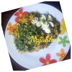 Palm oil rice and beans with spinach A picture of Palm oil rice and beans with spinach.