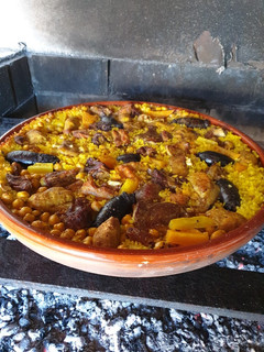 Una foto de Arroz al horno hecho a la leña