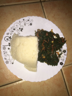 A picture of Pumpkin leaves + spinach served with ugali.